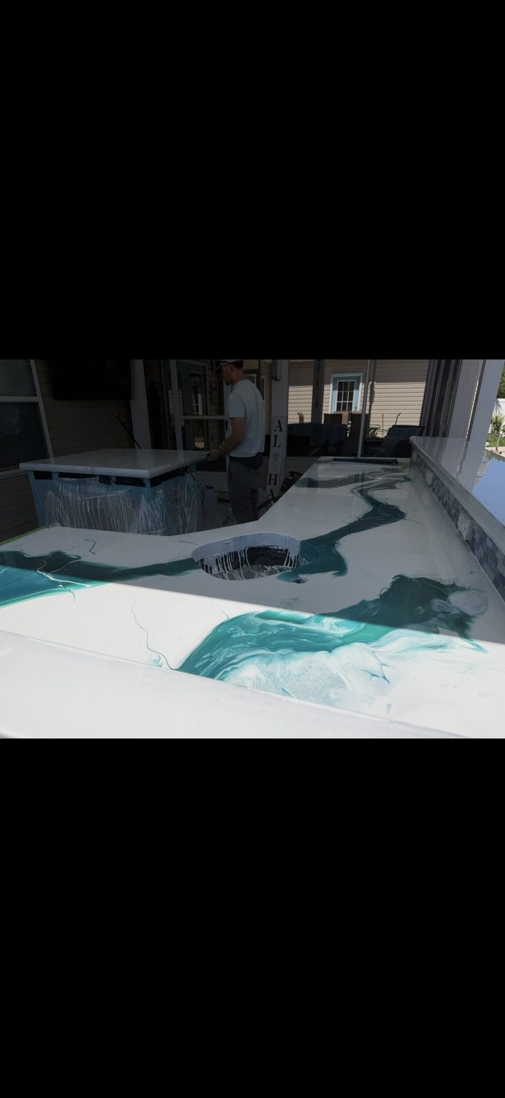 Metallic epoxy bar top with drink cutout