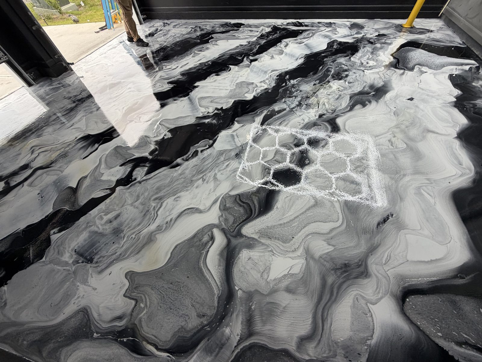 Black and white metallic epoxy floor, wide view