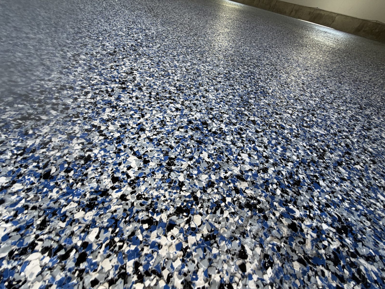Blue and white flake epoxy floor close-up