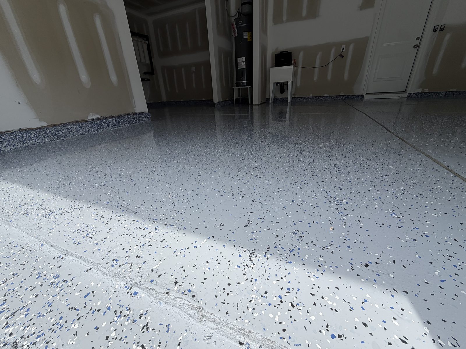Finished grey flake epoxy garage floor